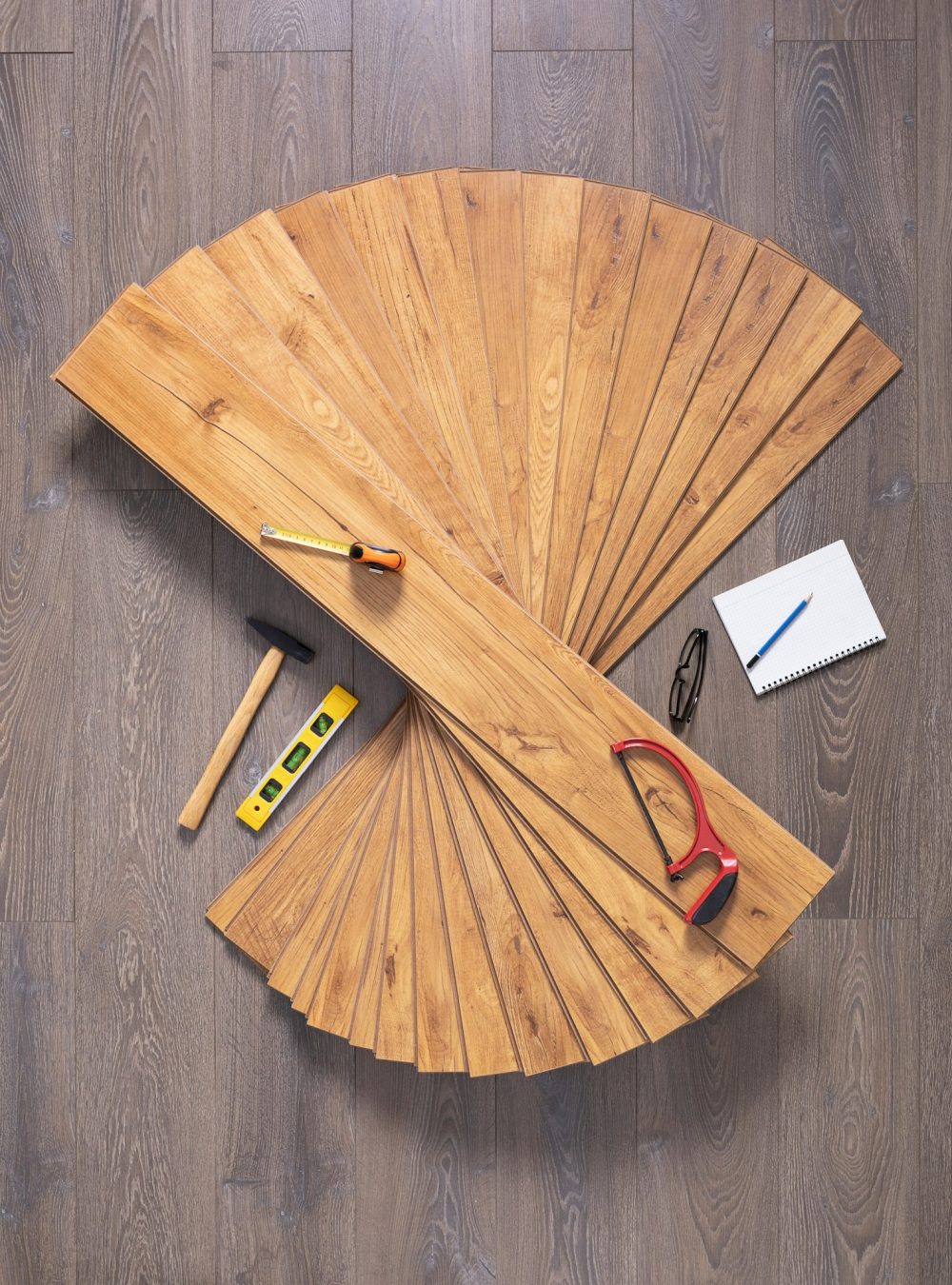 Laminate floor on wood background texture and tools. Wooden laminate floor plank